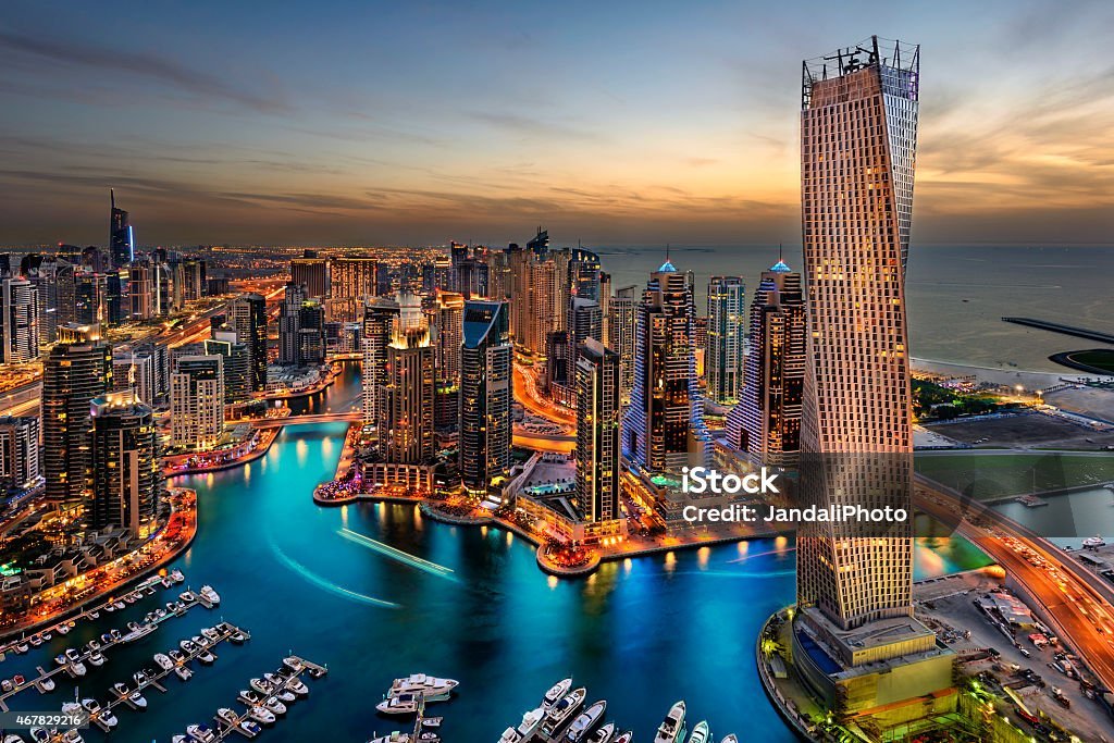 Dubai Marina from a high view showing the boats, sea, and the city scape.
